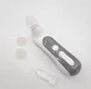 A white and gray electric nasal aspirator with accessories on a white background. Anteprima dell’immagine prodotto