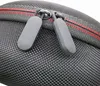 A close-up view of the zippers on a black headphone case with red trim. Produktbild-Vorschau