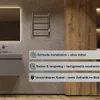 A modern bathroom with a towel warmer mounted on the wall. Produktbild-Vorschau