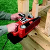 A person is using a belt sander on a wooden railing outdoors. Anteprima dell’immagine prodotto