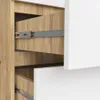Close-up view of an open drawer in a wooden and white cabinet, showing drawer slides. Produktbild-Vorschau