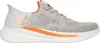 A side view of a gray Skechers slip-on sneaker with orange accents. Voir les images du produit