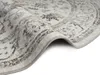 A close-up view of a rolled-up oriental rug with a vintage design. Náhled obrázku produktu
