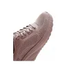A close-up view of the toe and side of a brown sneaker. Voir les images du produit