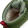 Close-up view of the inside of a green boot, showing the fuzzy lining and a red pull tab. Produktbild-Vorschau