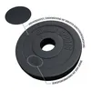 A close-up, angled view of a black weight plate with text annotations. Produktbild-Vorschau