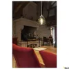 A dimly lit restaurant or dining area with a large stone fireplace and wooden beams. Náhľad obrázku produktu