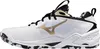 A side view of a white Mizuno handball shoe with black and gold accents. Voir les images du produit
