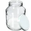 A clear glass jar with a white lid next to it, isolated on a white background. Anteprima dell’immagine prodotto