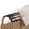 A close-up view of the top part of a wicker-style outdoor sofa with a beige canopy and a black metal folding mechanism. Voir les images du produit
