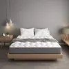 A mattress on a wooden bed frame in a bedroom setting. Produktbild-Vorschau