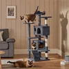 Three cats interact with a multi-level cat tree in a living room setting. Produktbild-Vorschau