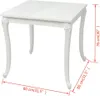 A white square dining table with ornate legs, shown from an angle with measurement indicators. Anteprima dell’immagine prodotto