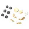 A collection of replacement parts for a game controller, including joysticks and paddles, laid out on a white background. Produktbild-Vorschau