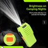 A neon green walkie-talkie with its flashlight on, set against a dark background with a tent in the background. Produktbild-Vorschau