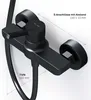 A close-up view of a black shower faucet with measurement indicators. Produktbild-Vorschau