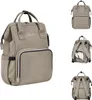 Multiple views of a beige diaper bag/backpack. Produktbild-Vorschau