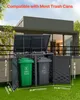 A trash can enclosure with two trash cans inside, shown outdoors in front of a modern house. Náhled obrázku produktu