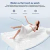 A woman is floating above a mattress, illustrating its comfort and support. Voir les images du produit