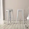 Two silver bar stools are shown in a room with wooden flooring and a light-colored wall. Dimensions are indicated with arrows and numbers. Náhľad obrázku produktu