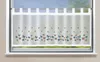 A sheer white curtain with a pattern of colorful butterflies is hung on a window.