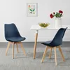 Two blue dining chairs are placed around a white dining table in a room with a light gray rug and a framed picture on the wall. Podgląd zdjęcia produktu