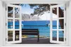 Wallario Poster mit Fenster-Illusion: Einsame Bank am Meer Produktbild-Vorschau 1