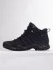 A black Adidas Terrex hiking boot is shown in profile against a white background. Anteprima dell’immagine prodotto