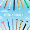 A collection of novelty pens with animal designs against a sky background with clouds. Produktbild-Vorschau