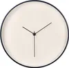 A minimalist wall clock with a beige face and a black frame and hands. Anteprima dell’immagine prodotto