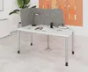 An office desk with a partition, lamp, and books. Anteprima dell’immagine prodotto