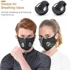 A man and a woman wearing black masks with silver breathing valves, with two extra valves shown at the top. Produktbild-Vorschau