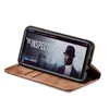 A smartphone case is shown in a brown color, with a smartphone displaying a movie poster inside. Produktbild-Vorschau