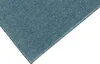 A close-up view of a blue carpet with a visible edge. Produktbild-Vorschau