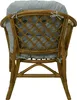 The back view of a rattan armchair with a gray cushion. Produktbild-Vorschau