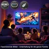 A family is watching TV in a dimly lit room, with colorful LED lights behind the TV. Produktbild-Vorschau