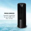 A black tower fan is shown against a background of a blue sky and the ocean. Náhled obrázku produktu