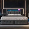 A modern bedroom with a bed featuring LED lighting and decorative neon signs. Náhľad obrázku produktu