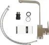 A collection of kitchen faucet parts and accessories laid out on a white background. Produktbild-Vorschau