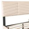 A close-up view of a beige upholstered headboard and the wooden slats of a bed frame. Podgląd zdjęcia produktu