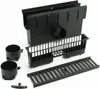A black drainage system kit composed of multiple parts, including a main channel unit, a grate, two cylindrical adaptors, and a small clip, laid out against a white background. Produktbild-Vorschau