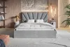 A bedroom scene featuring a bed, nightstands, and shelves. Náhled obrázku produktu