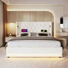 A modern bedroom with a white upholstered bed as the main focus. Produktbild-Vorschau