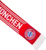 A close-up, diagonal view of a red and white FC Bayern München scarf with the team's crest and the word "MÜNCHEN" visible. Produktbild-Vorschau