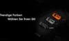 Three Nitecore TINI 3 LED keychain flashlights in different colors (orange, gray, black) are displayed on a textured black surface, with German text overlaying the left side of the image. Podgląd zdjęcia produktu
