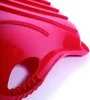 A close-up, angled view of a red plastic snow sled. Voir les images du produit