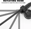 A close-up shot of a black bicycle shock pump with a rotating hose feature, illustrated with ghosted images showing its range of motion. Produktbild-Vorschau