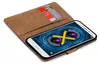 A book-style phone case with credit cards inserted, showing a smartphone screen with a camera graphic. Produktbild-Vorschau