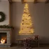 A cozy living room scene with a fireplace and a wall-mounted Christmas tree. Podgląd zdjęcia produktu
