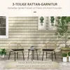 A rattan bistro set with two chairs and a table on a patio with a shingled wall in the background. Náhled obrázku produktu